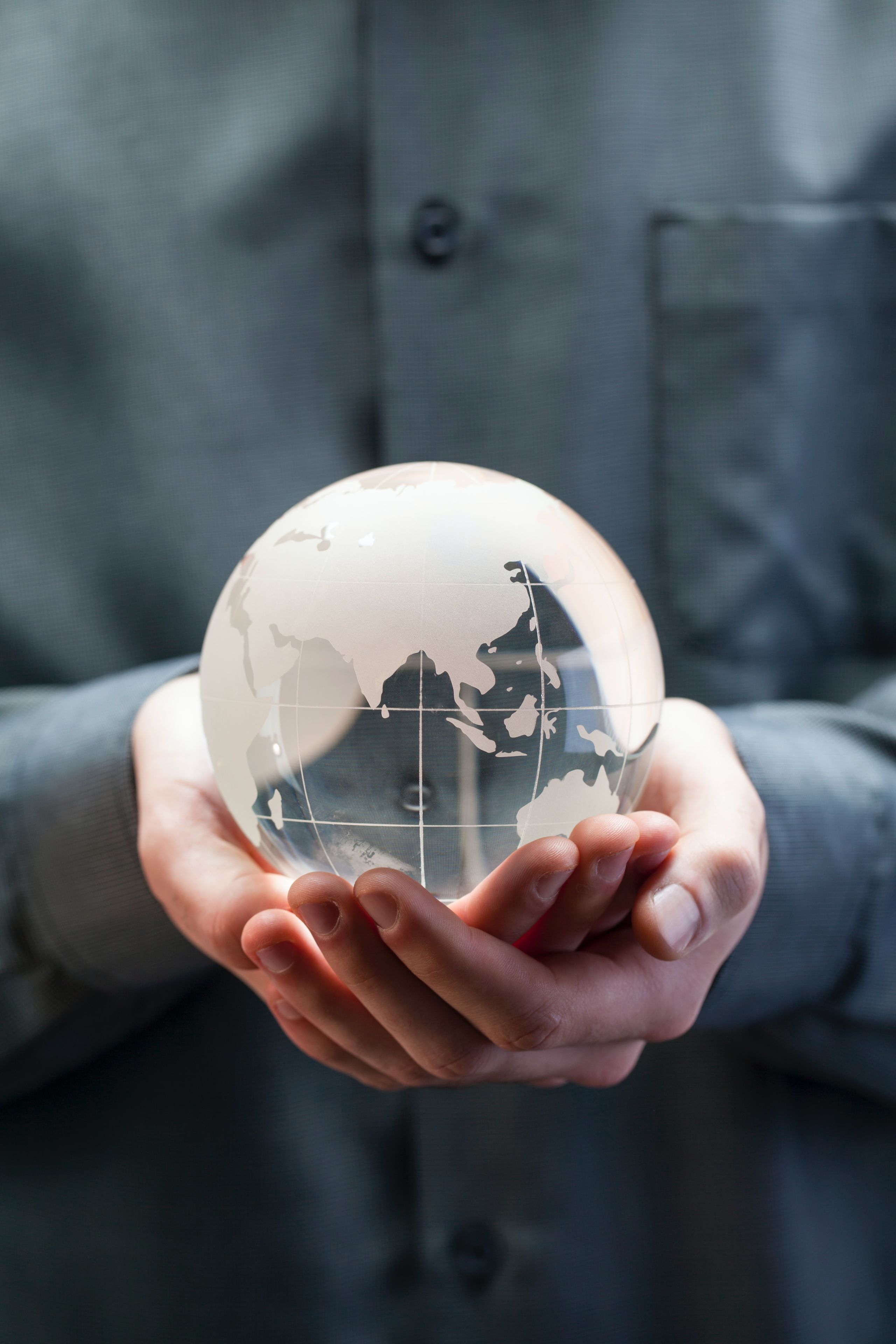Person with globe in their hands.