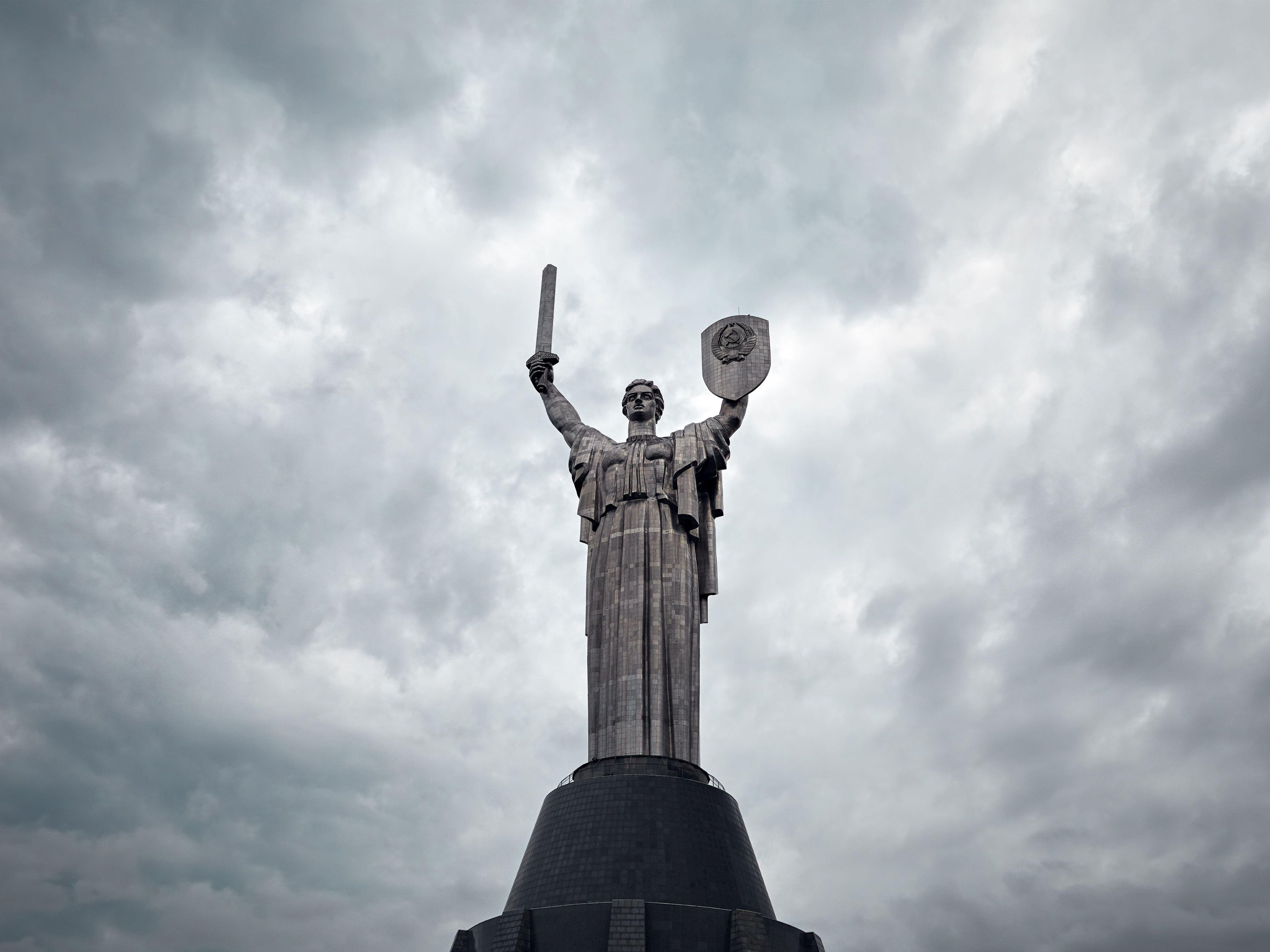 Motherland statue in Kyiv with grey clouds in background