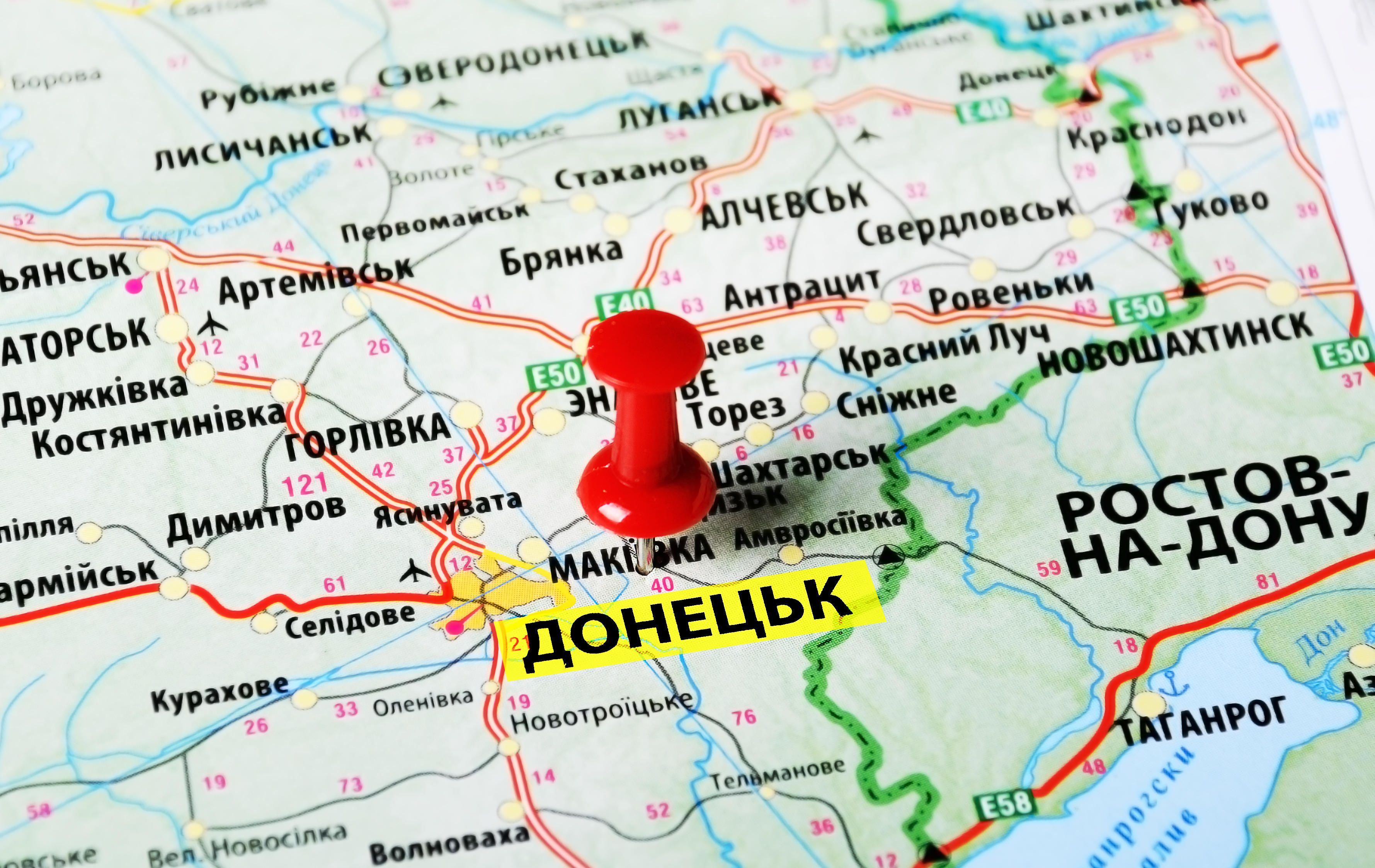 Close up of donetsk on map with red pin