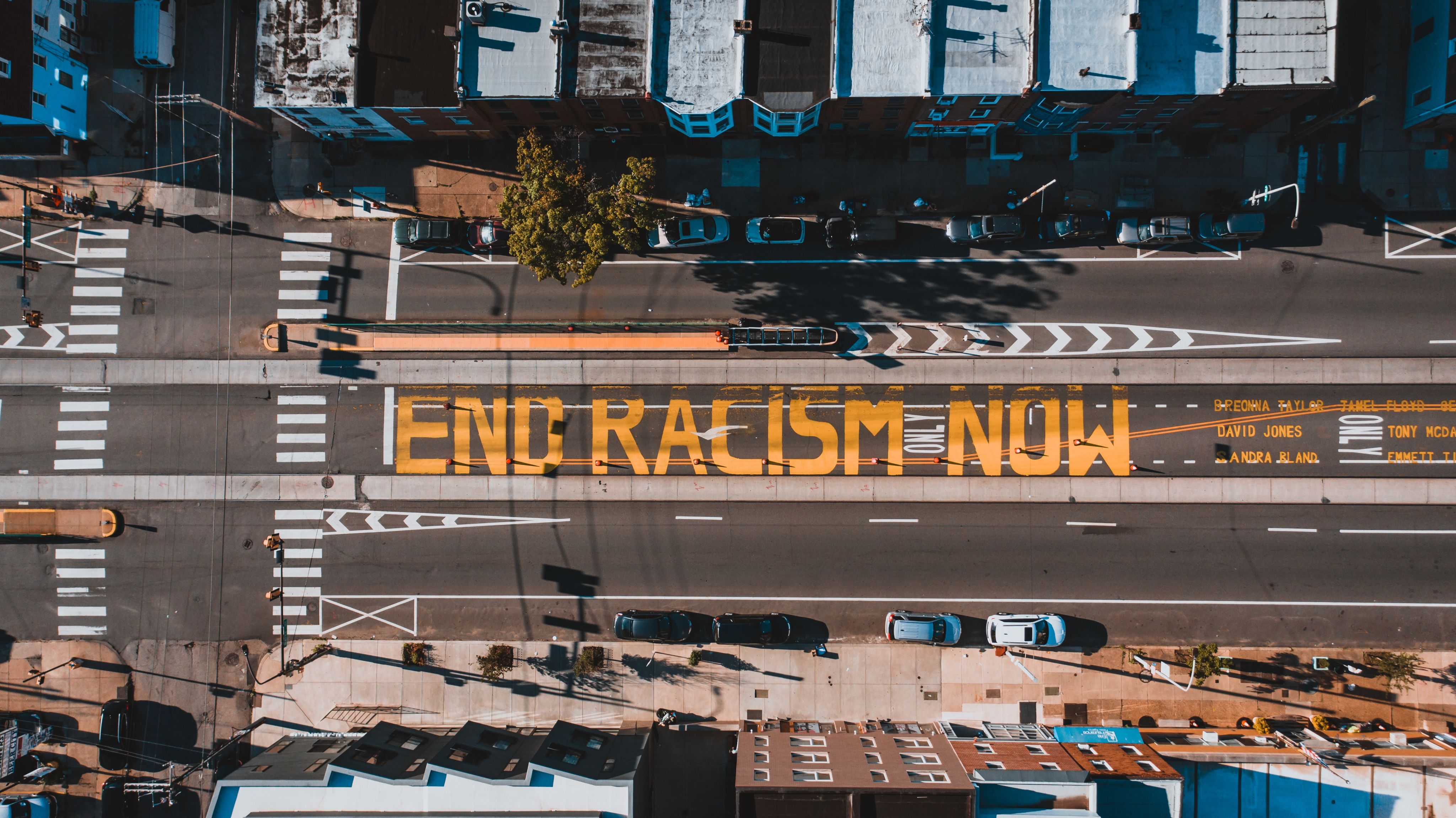 Roadway in Philadelphia with writing "End Racism Now"