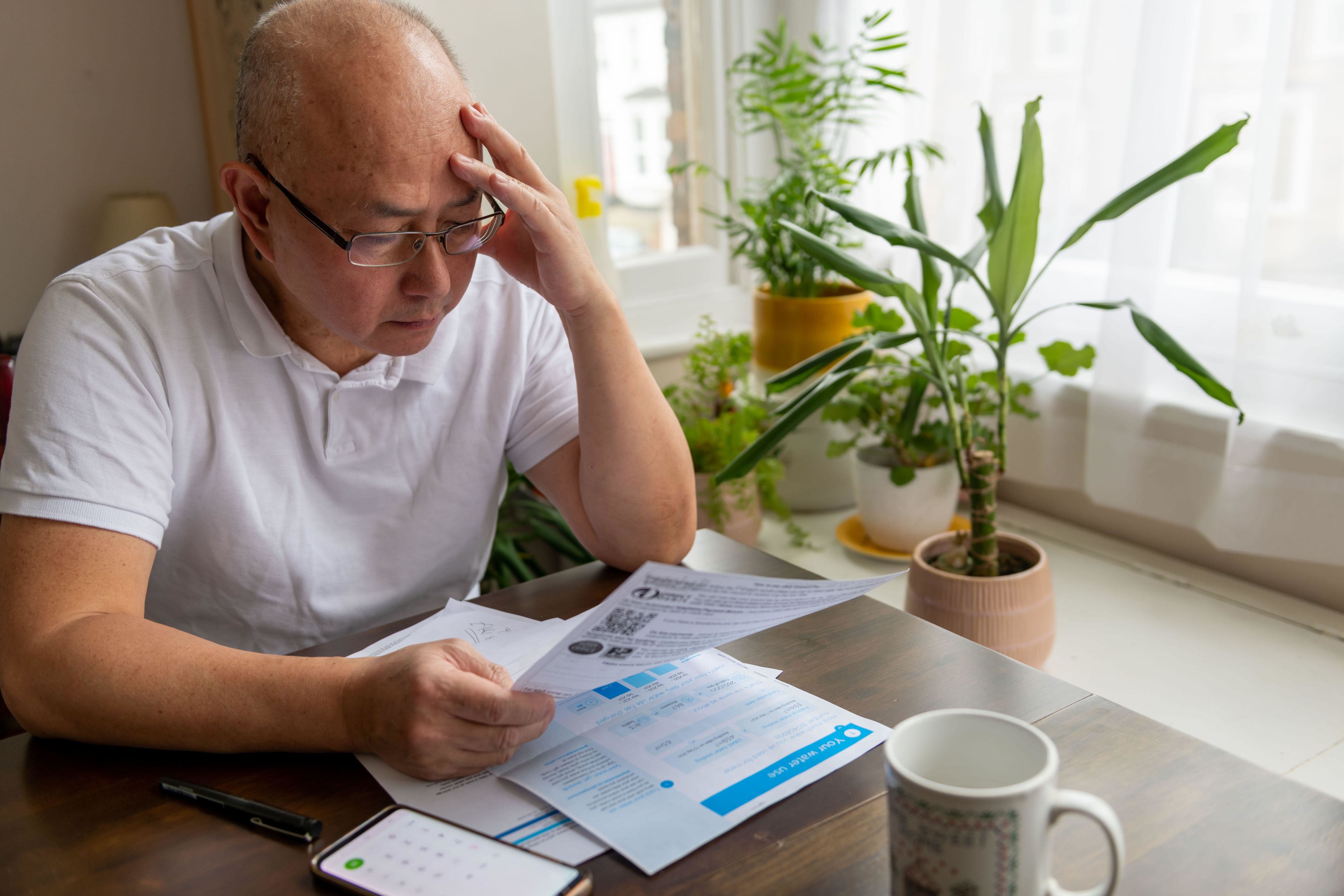 Senior man looking at his bills