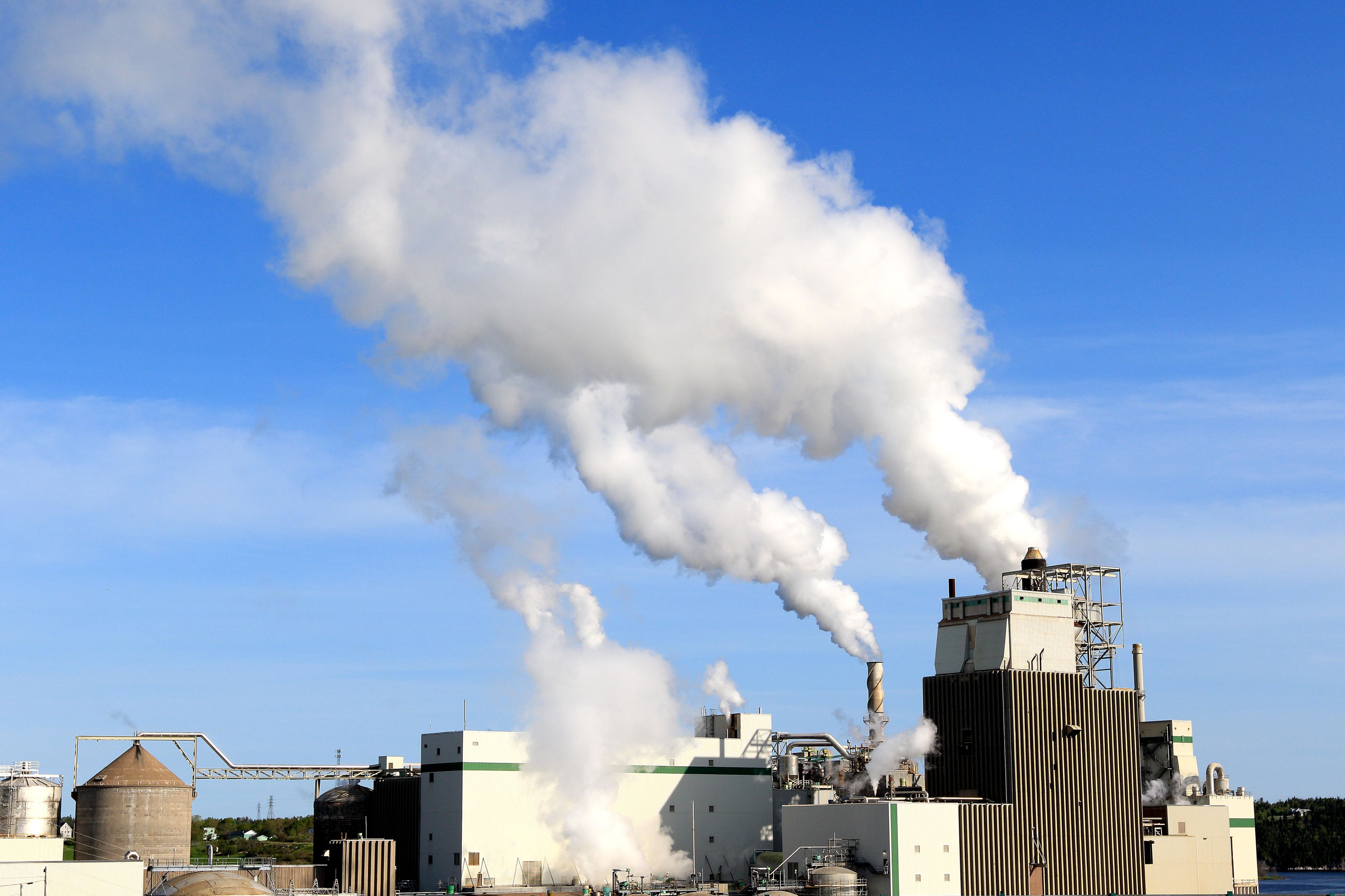 Smoke coming out of factory chimneys