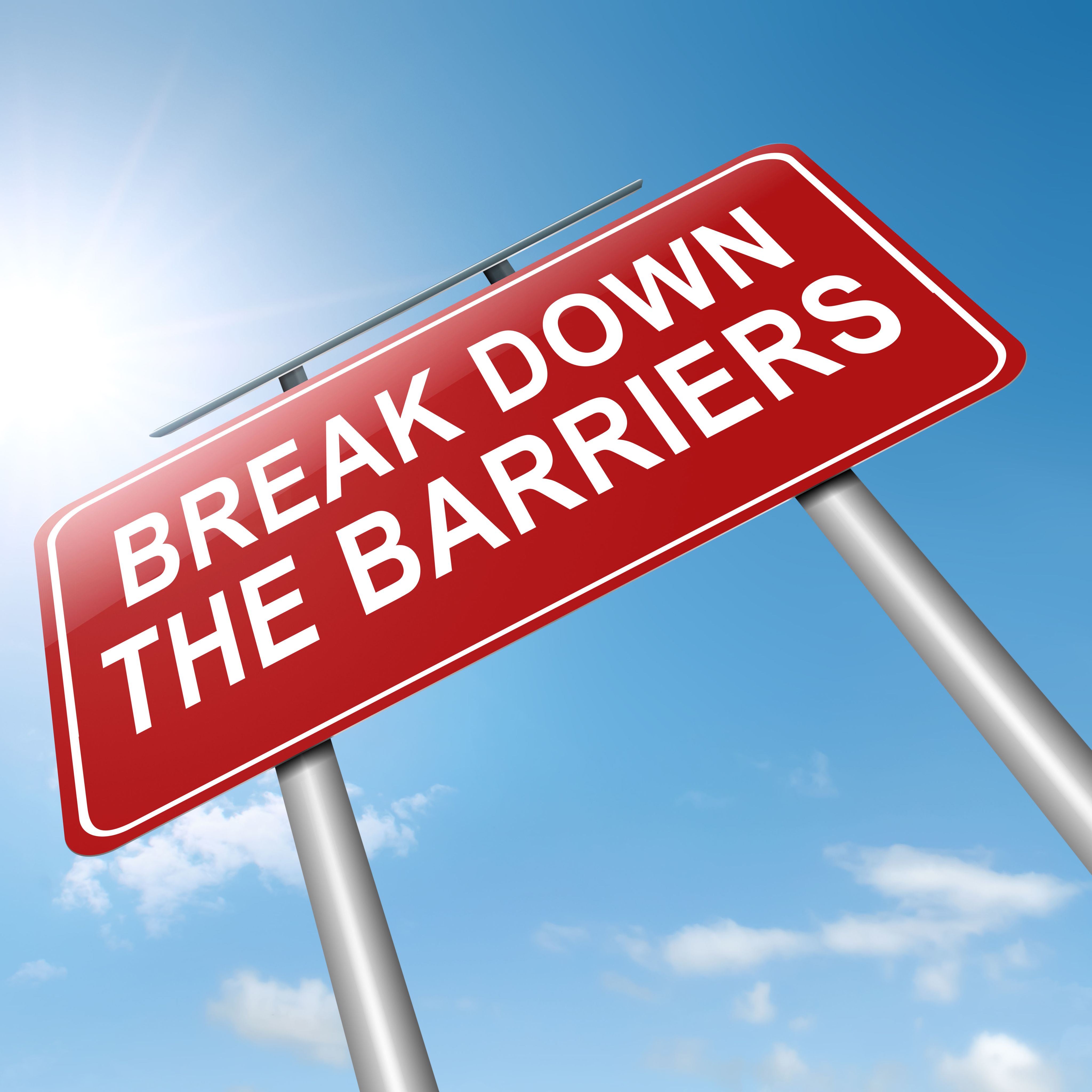 A sign that says "break down the barriers".