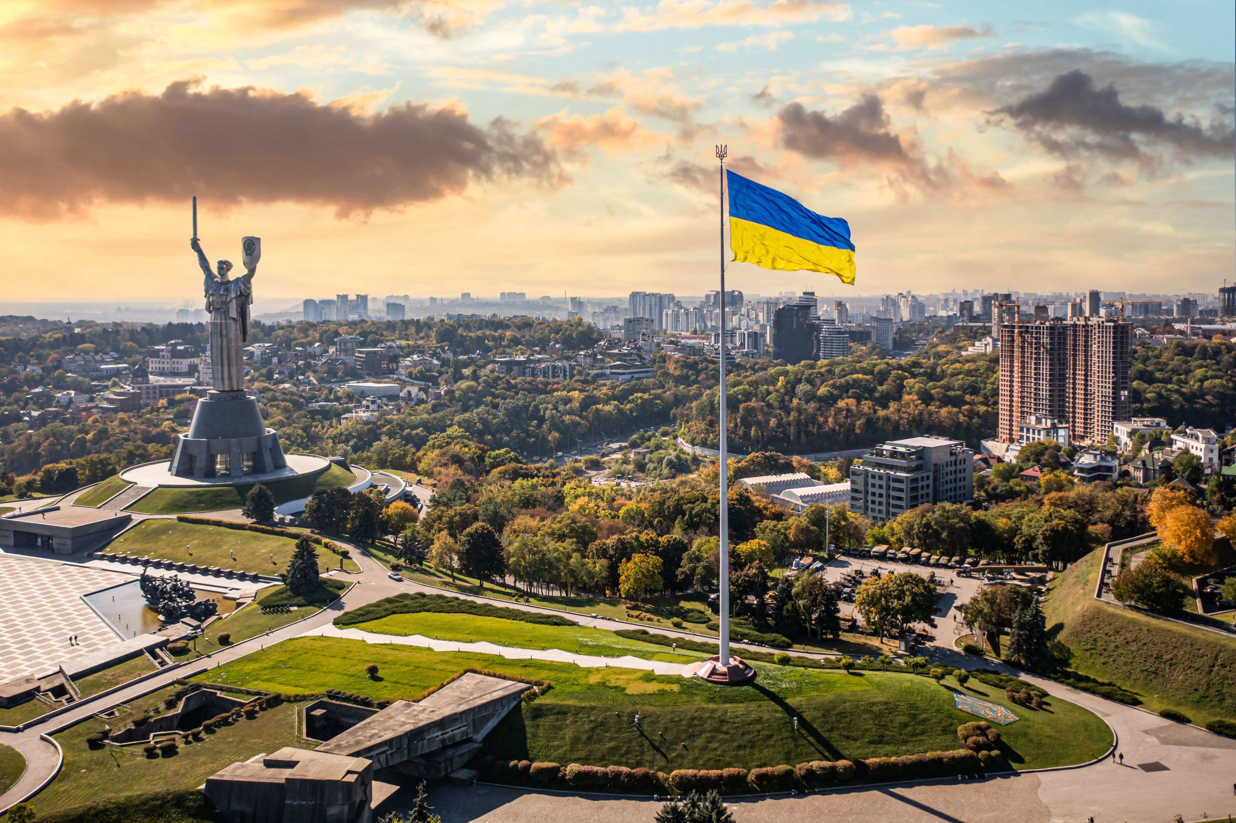 View of Kyiv including Ukrainian flag and Motherland statue