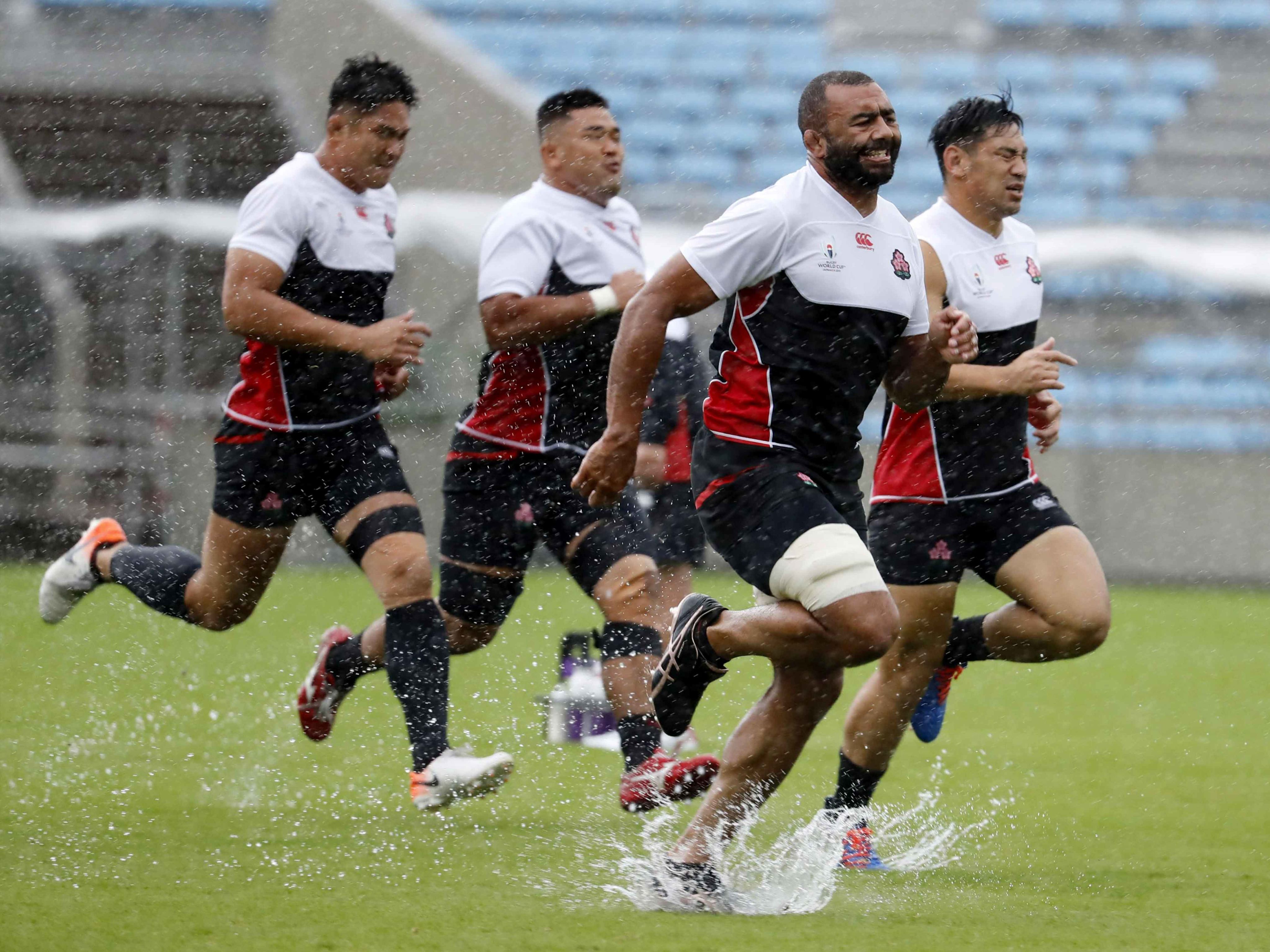 Japan rugby players train the rain