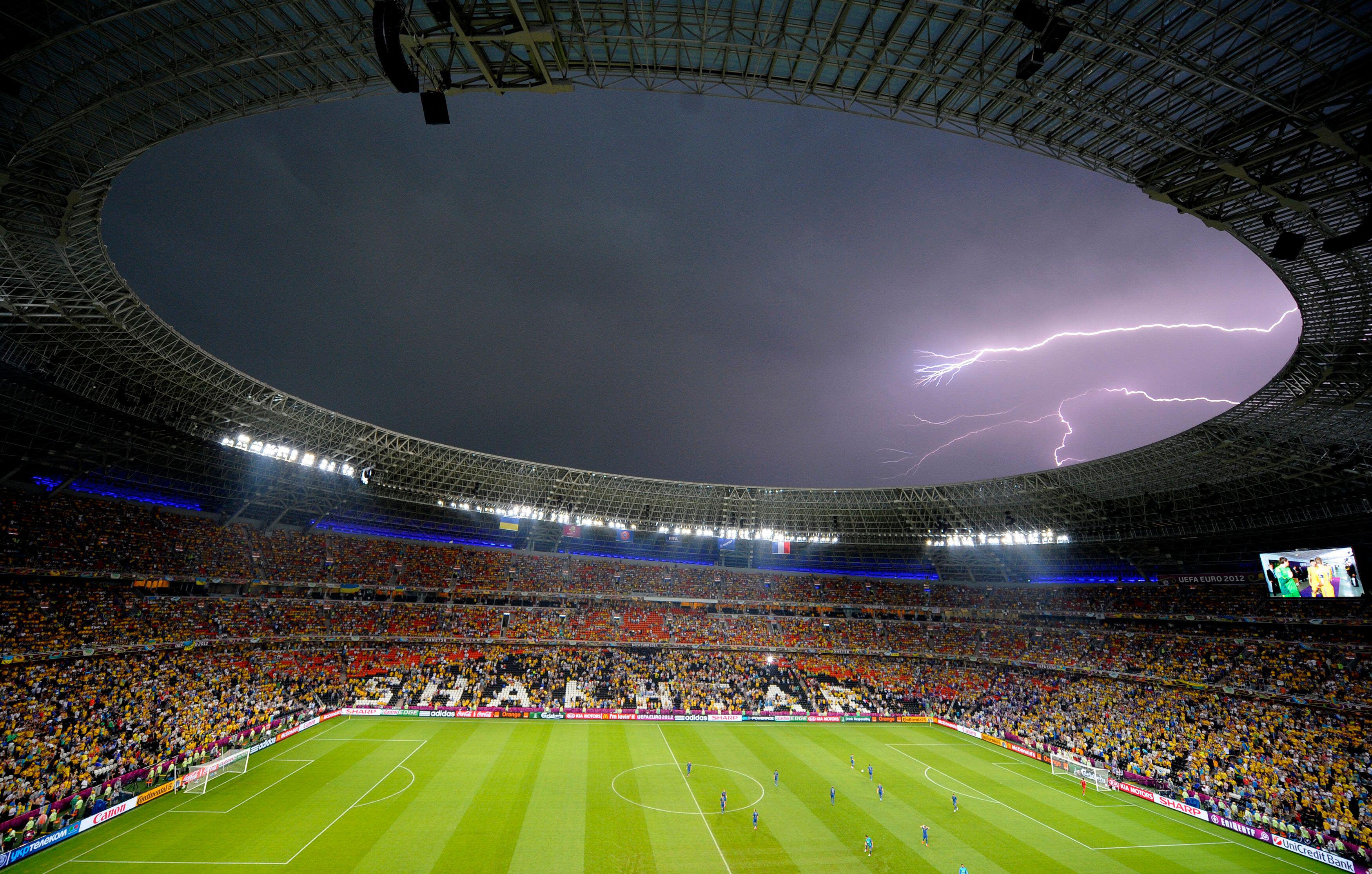 Lightning is seen on the sky above the Donbass Arena, Donetsk