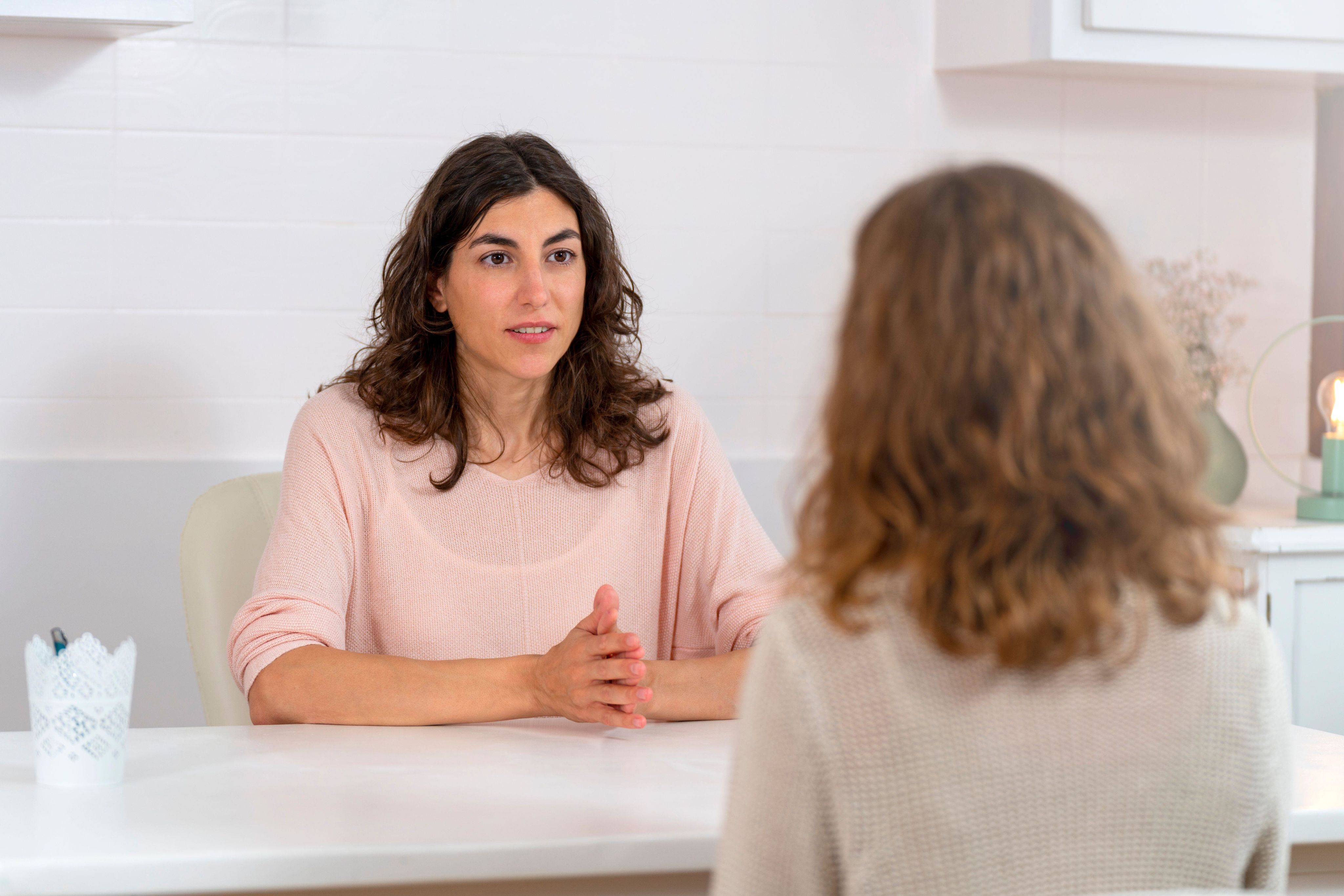 Two women talking in a health clinic.