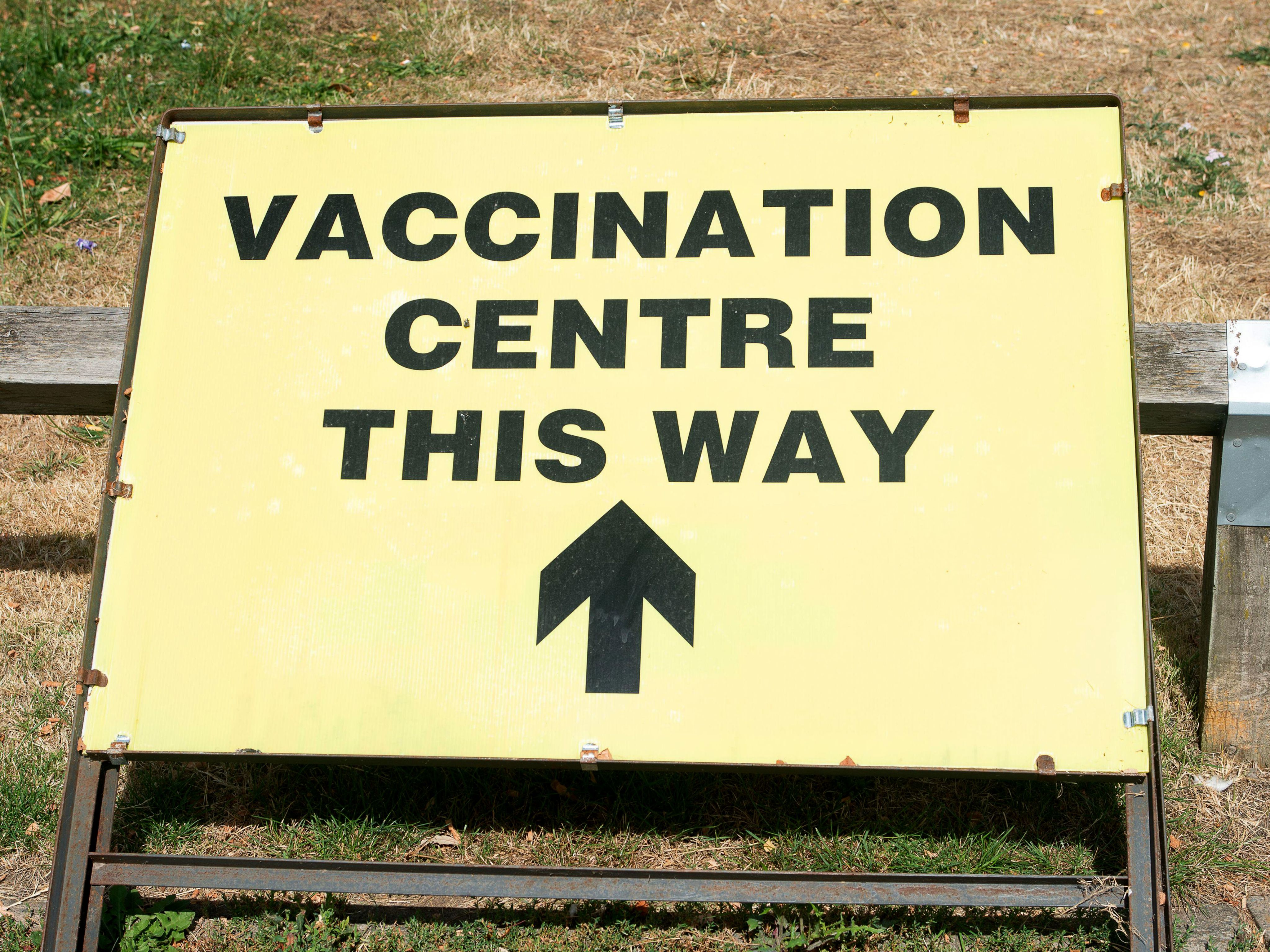 Yellow U.K. Vaccination Center sign