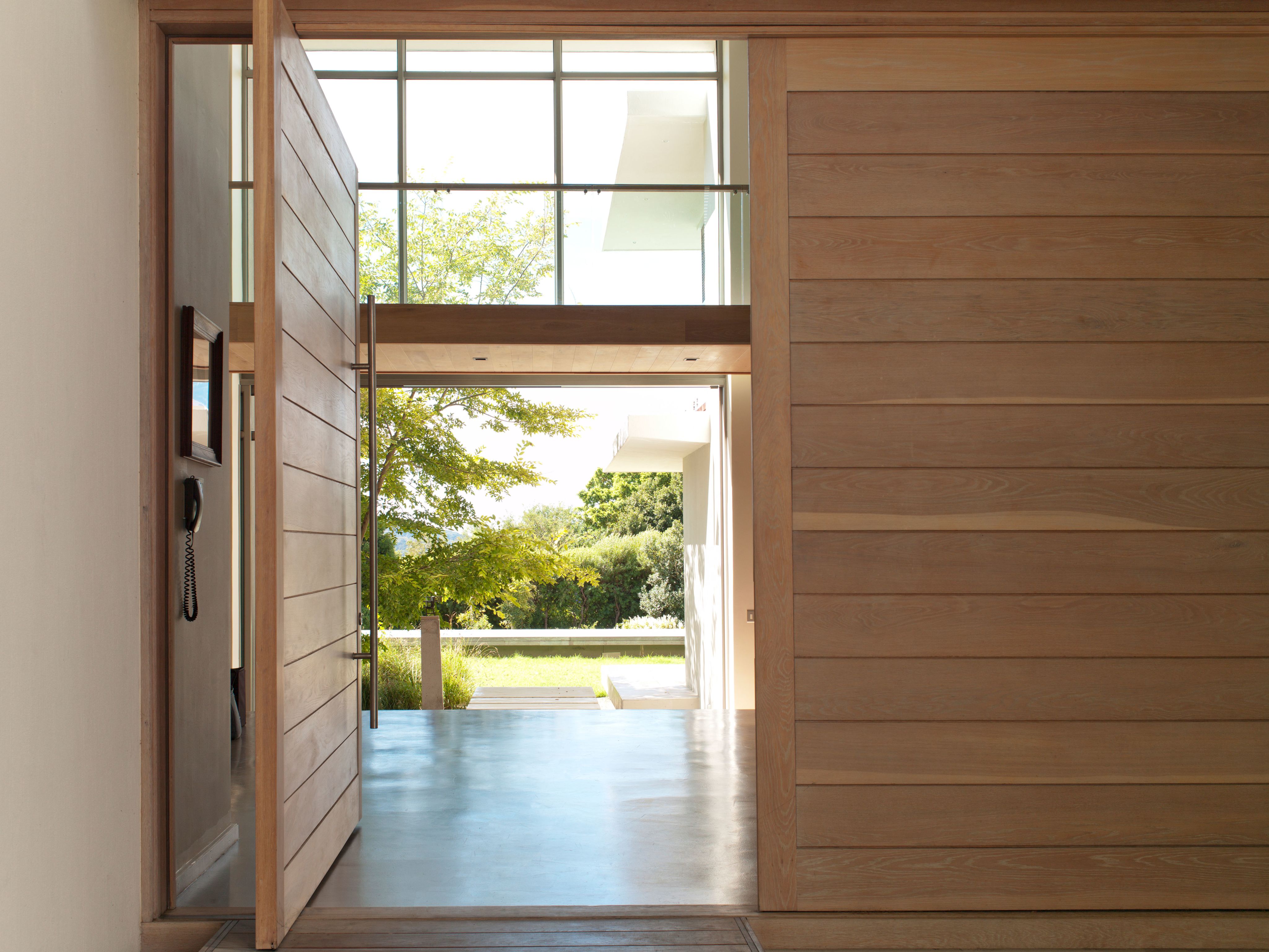 Door of a modern house wide open to the outside