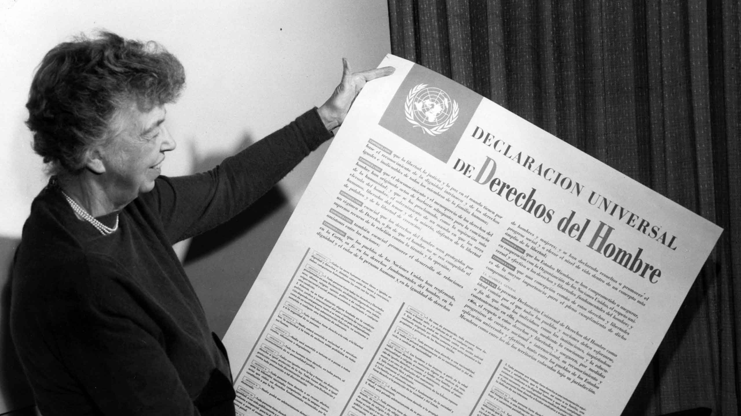 eanor Roosevelt displays a Spanish language version of the Universal Declaration 1949