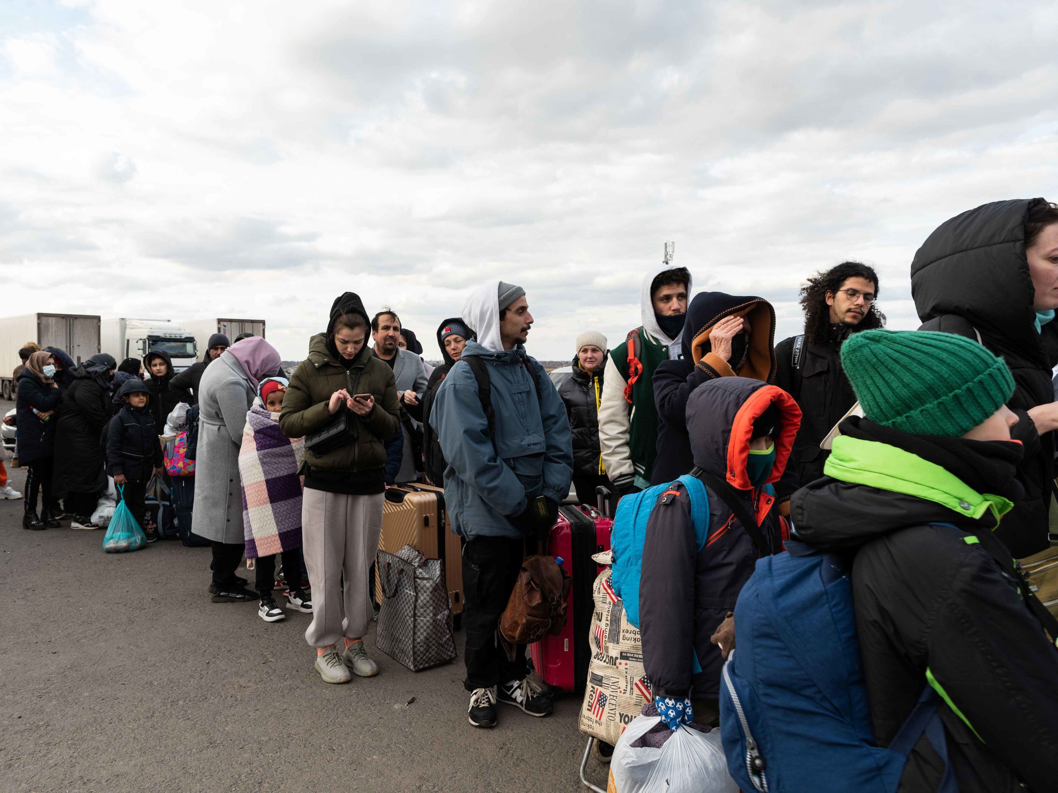 Displaced Ukrainians queue