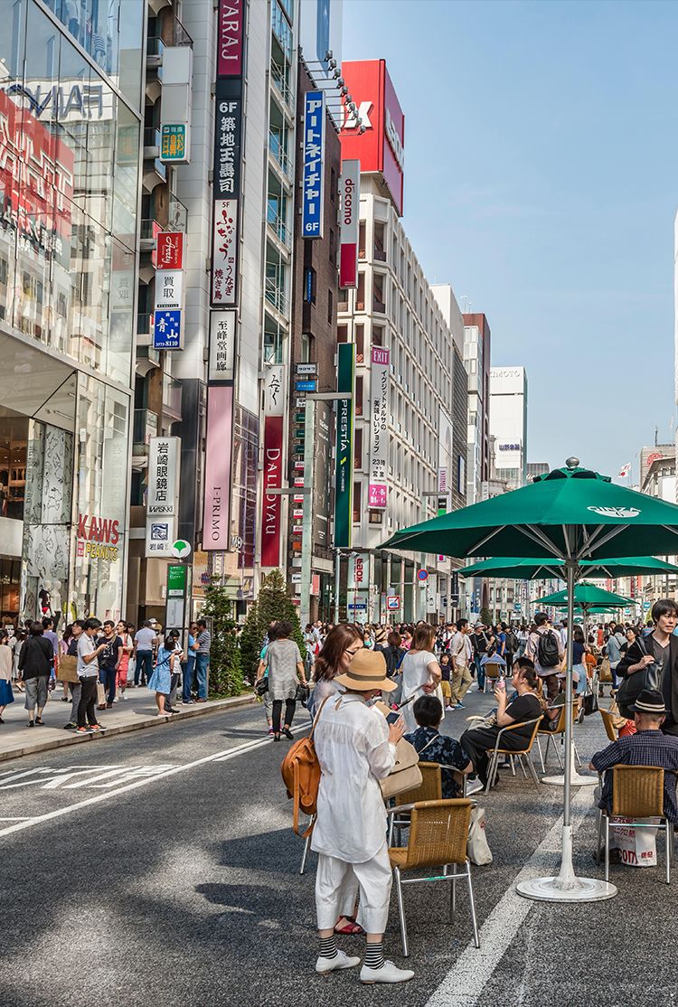 Care free street in Toyo, Japan with pedestrians and cafe seating