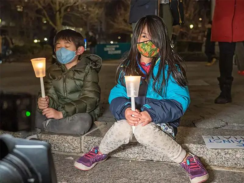 Two children holding lanterns