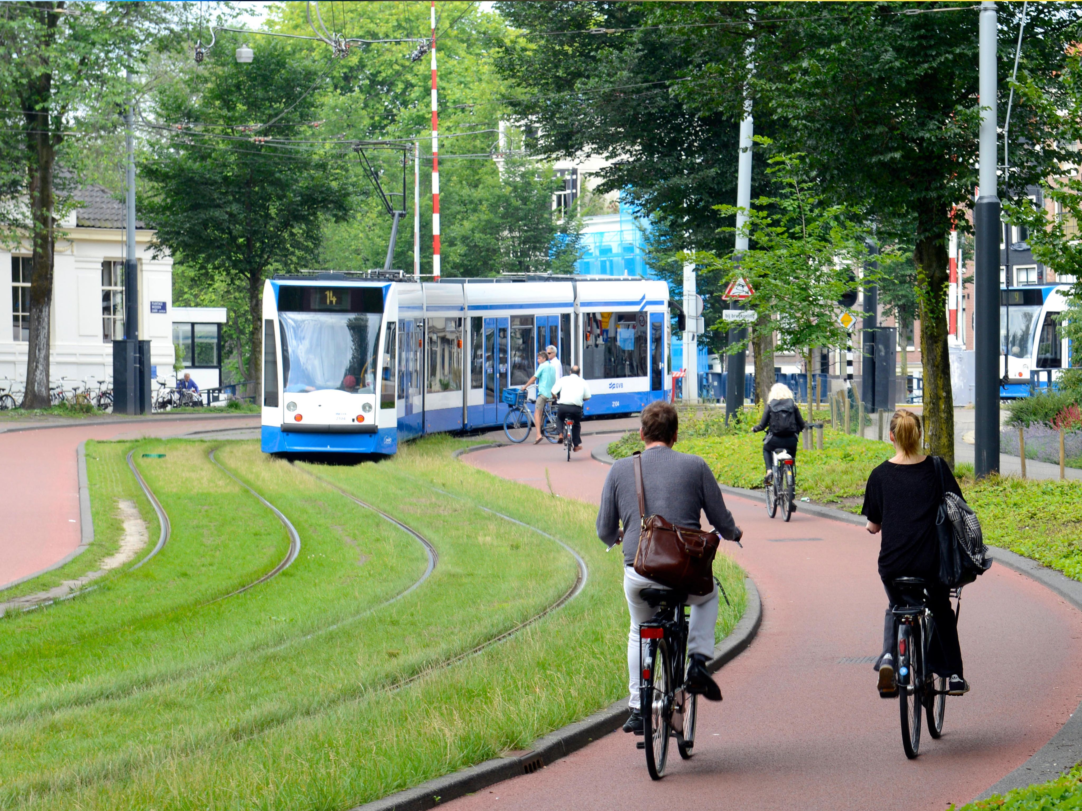 Cyclists and a tram in Amsterdam
