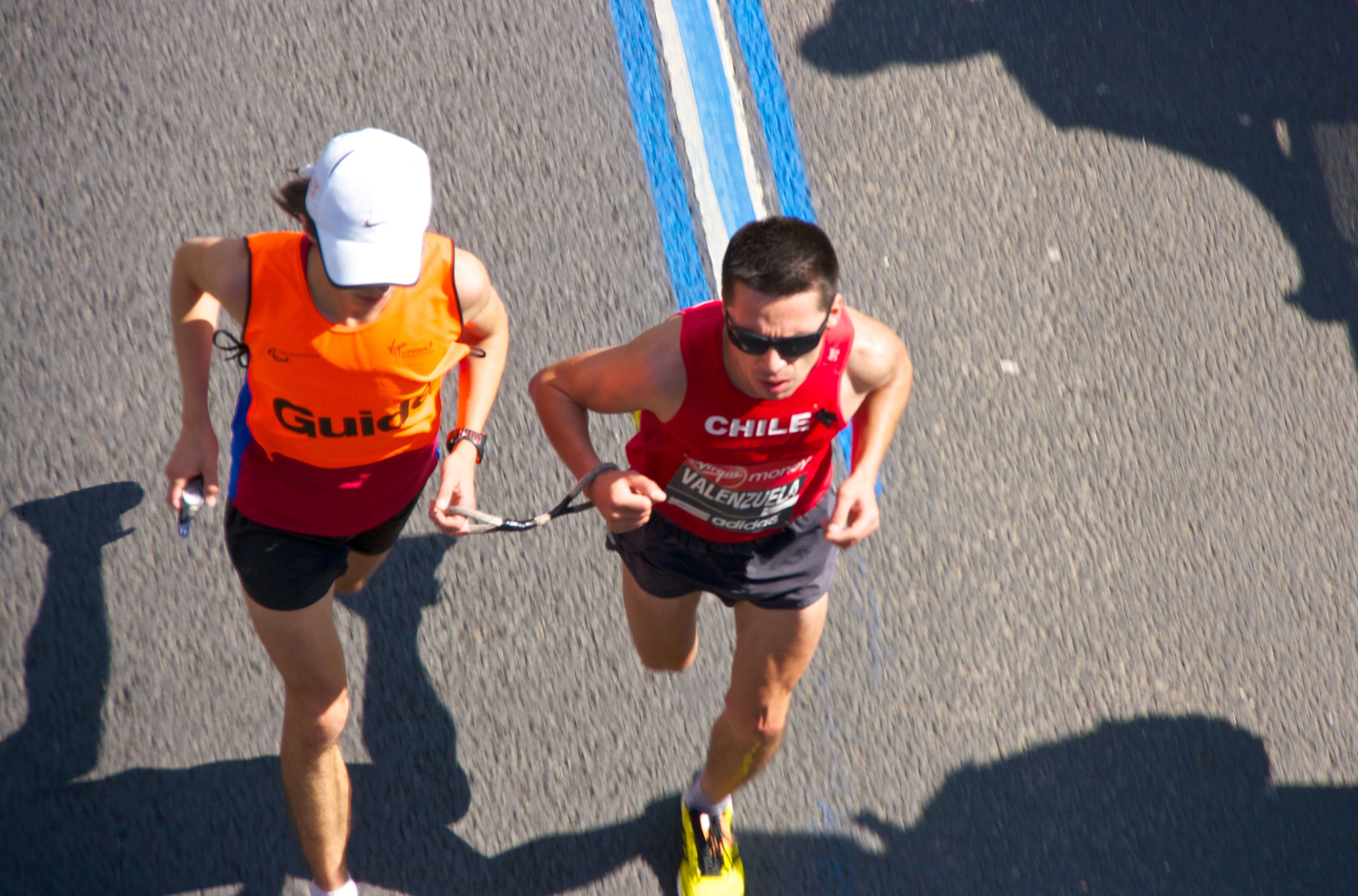 Blind marathon runner with guide
