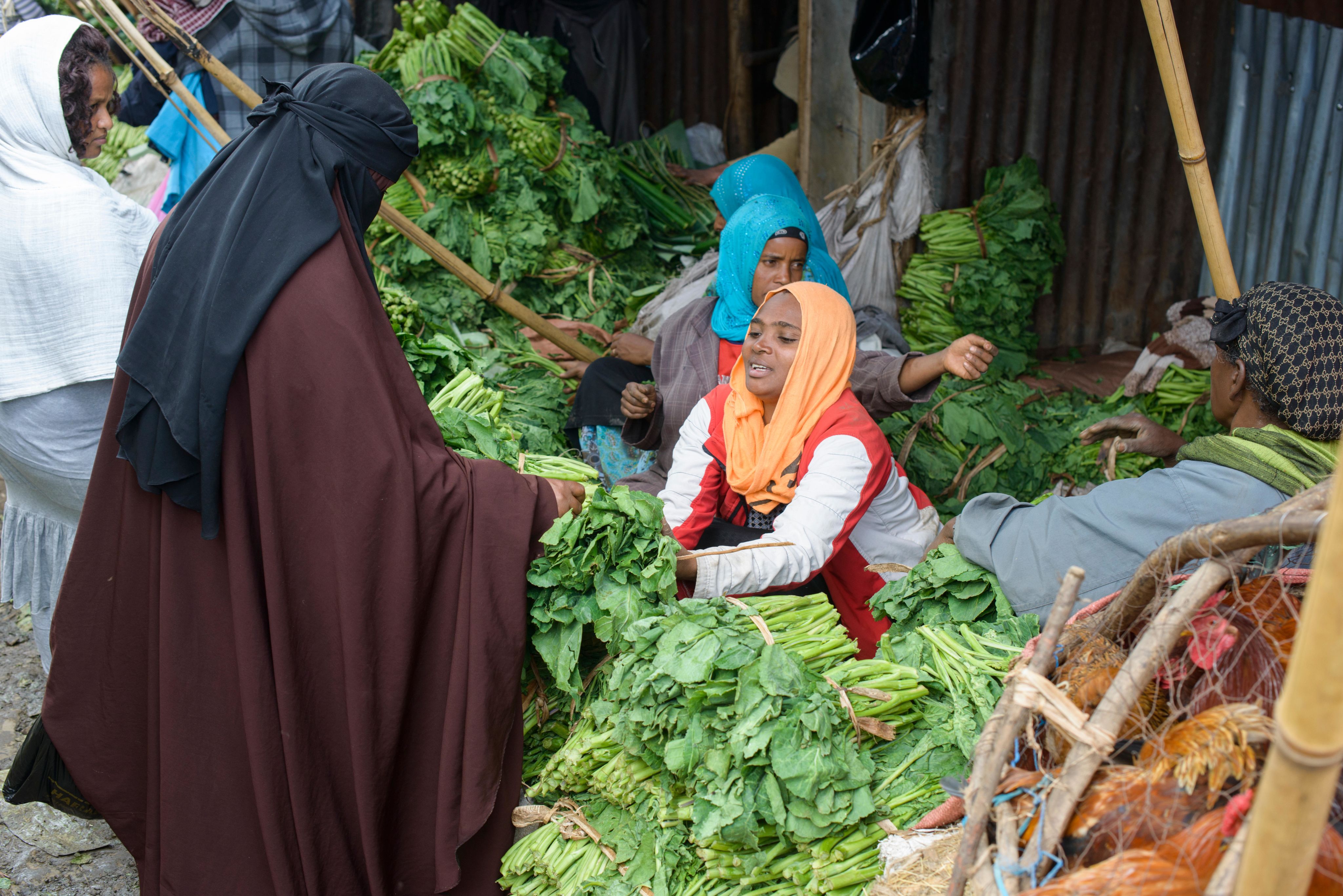 A muslim woman buying vegetables, Mercato of Addis Abeba, Ethiopia