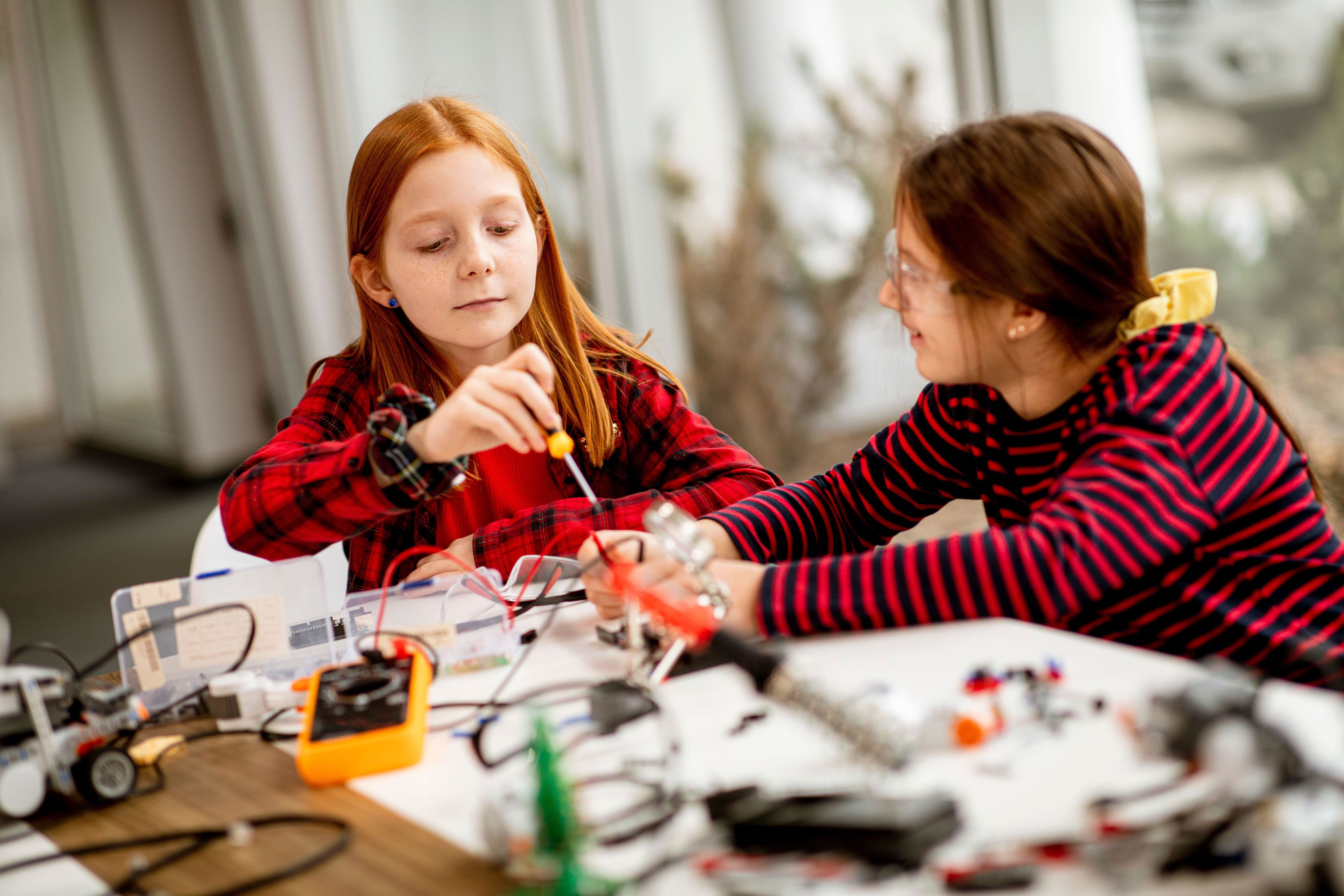 Two girls working with electronics