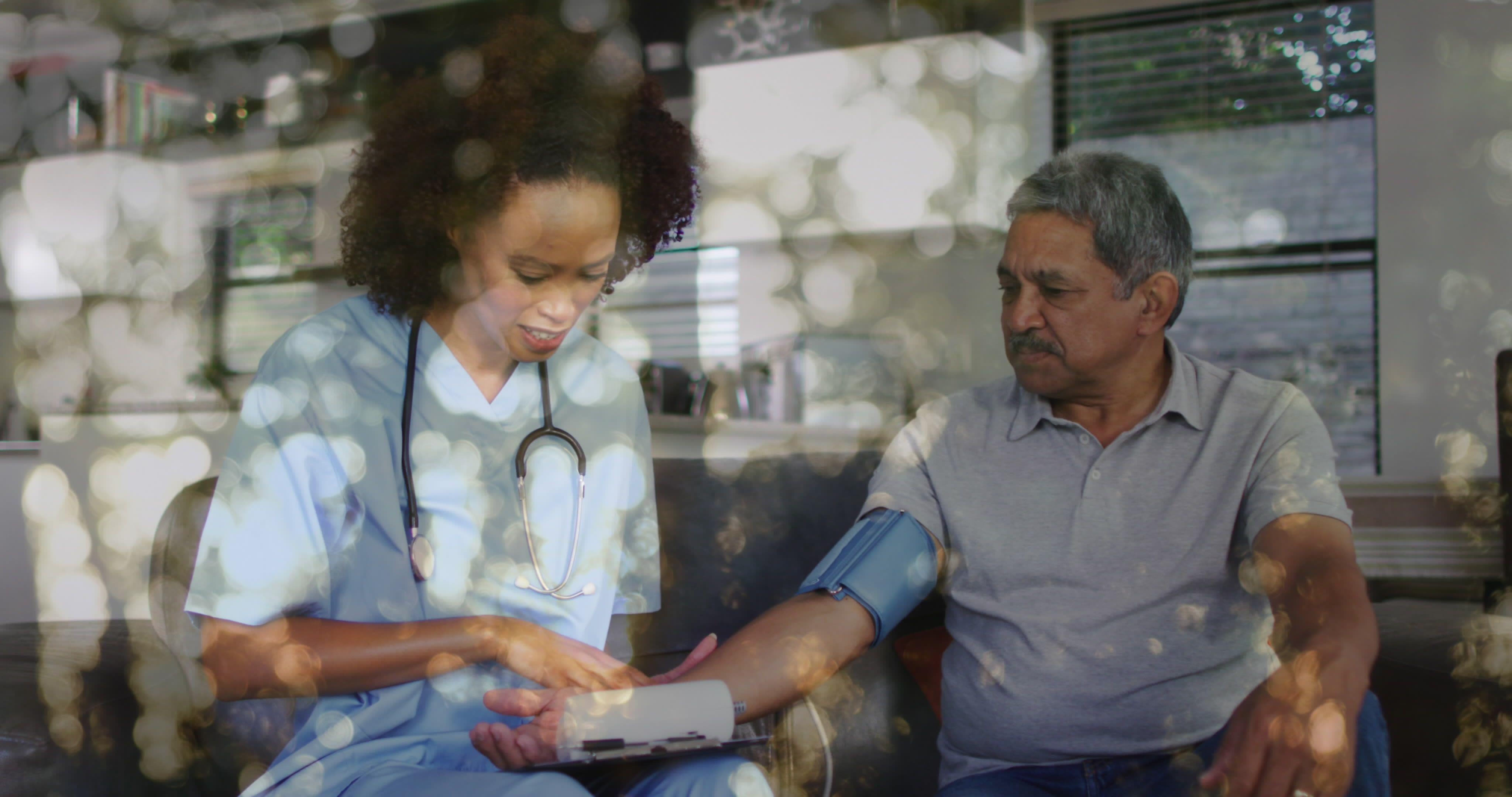 Doctor checking a person's blood pressure.