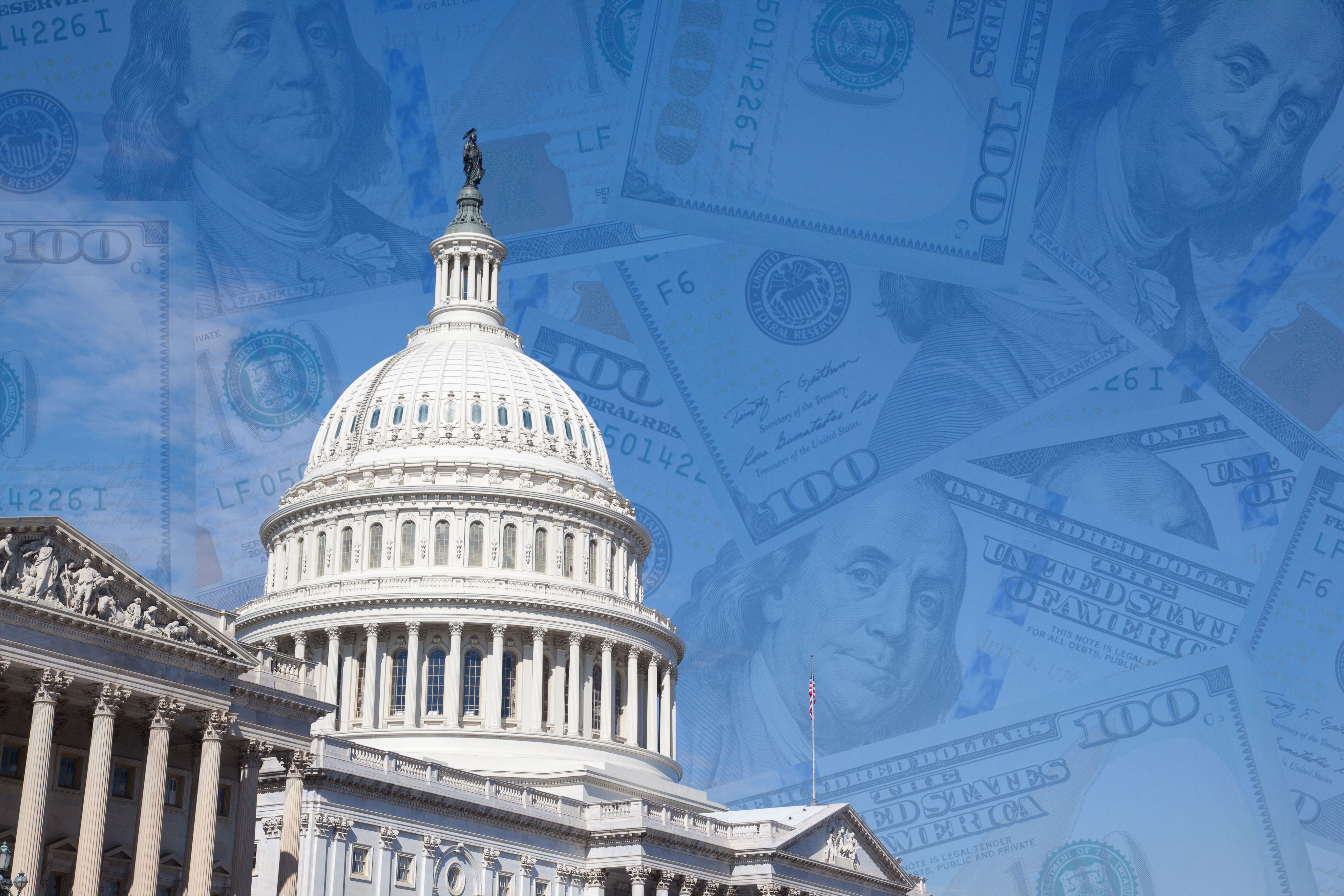 The US Capitol building with a backdrop of American hundred dollar bills