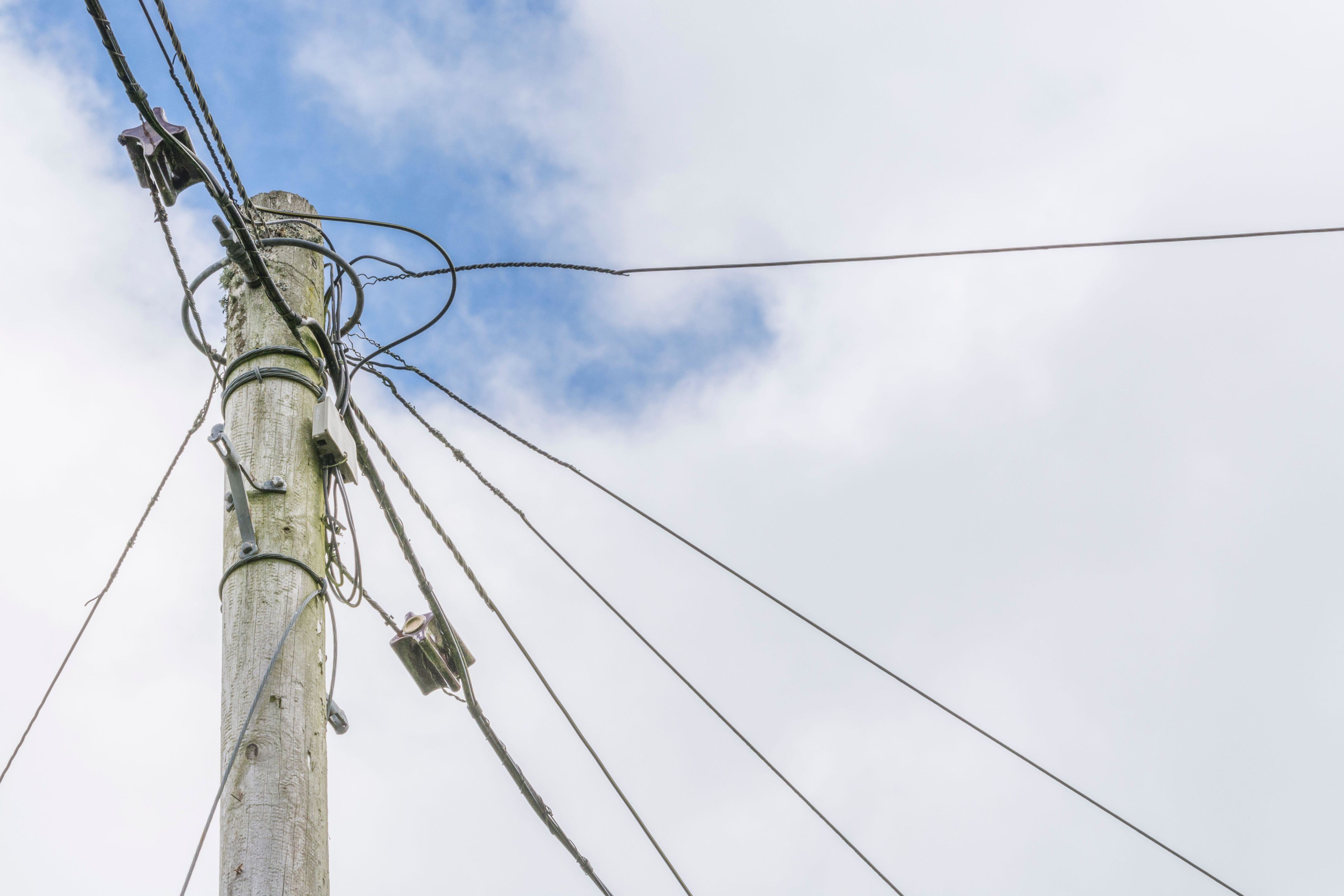Rural BT utility pole with various fibre optic broadband & telephone wires