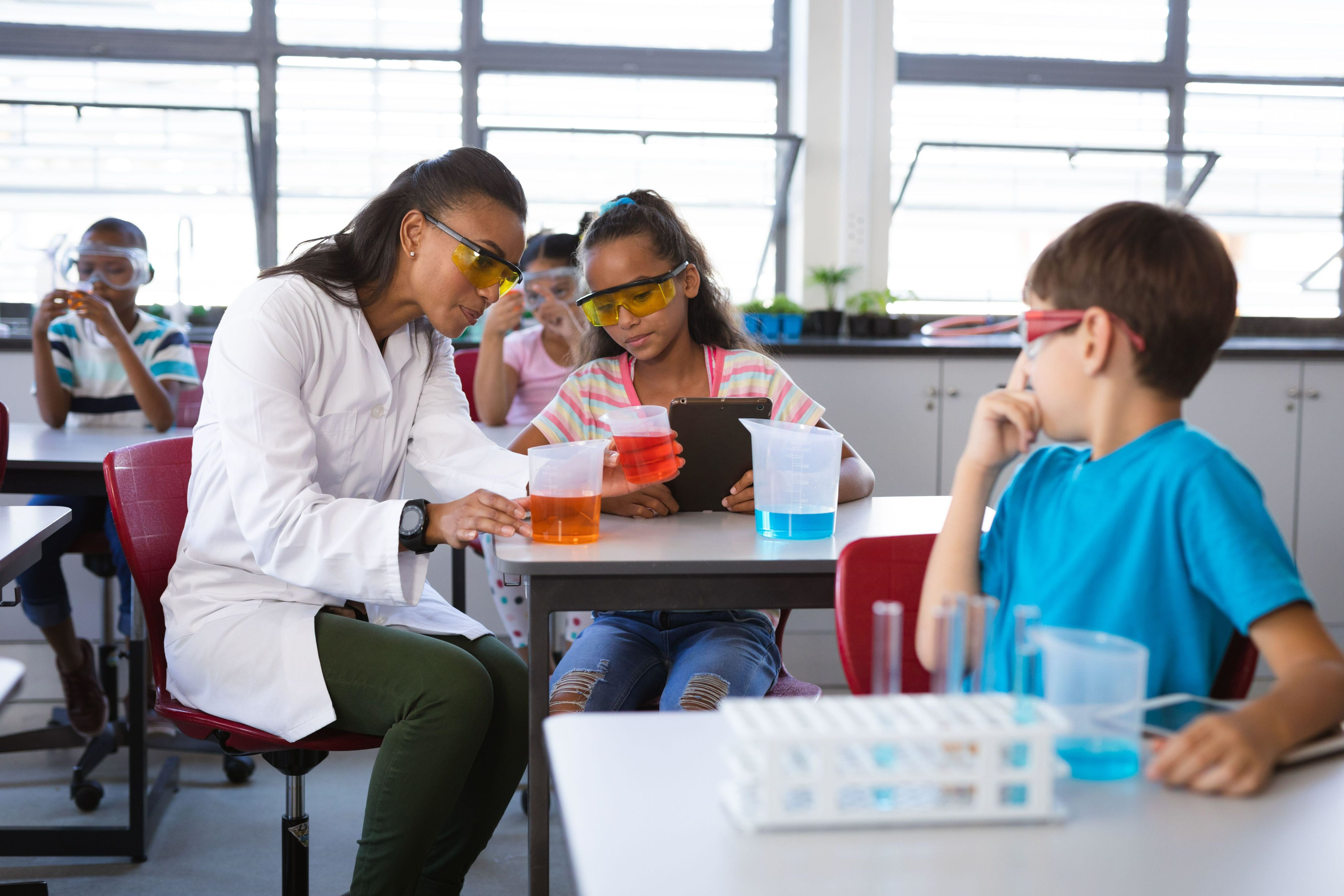 Science teacher teaching chemistry