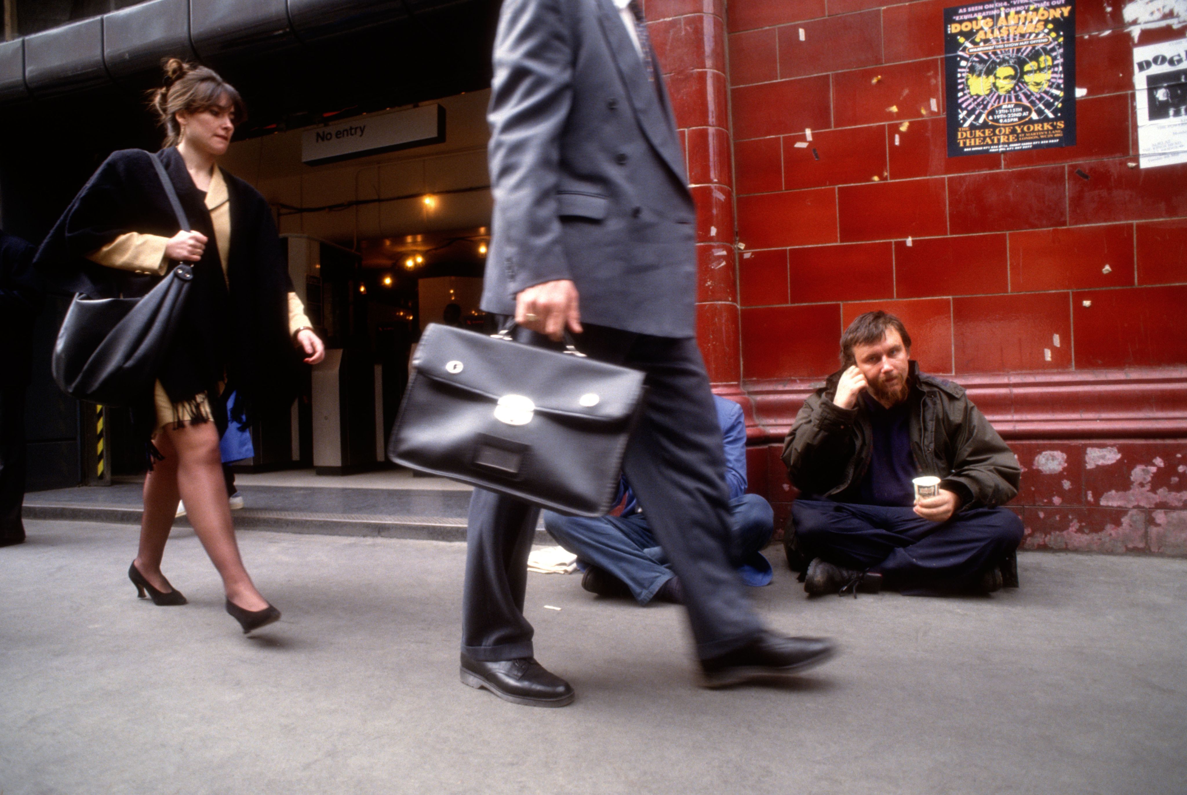 Begging outside Covent garden tube in central London