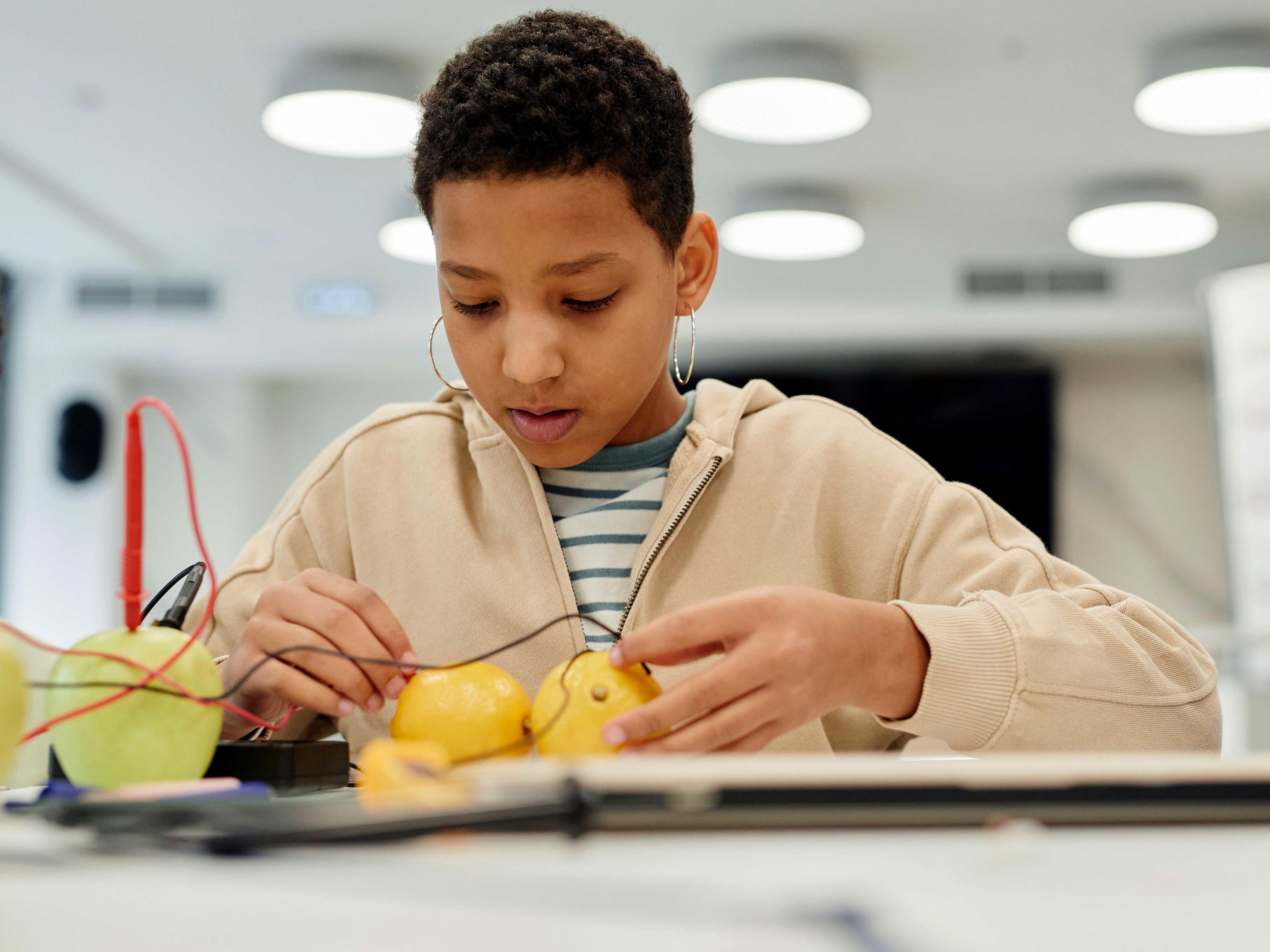 Girl conducting science experiment with probes.