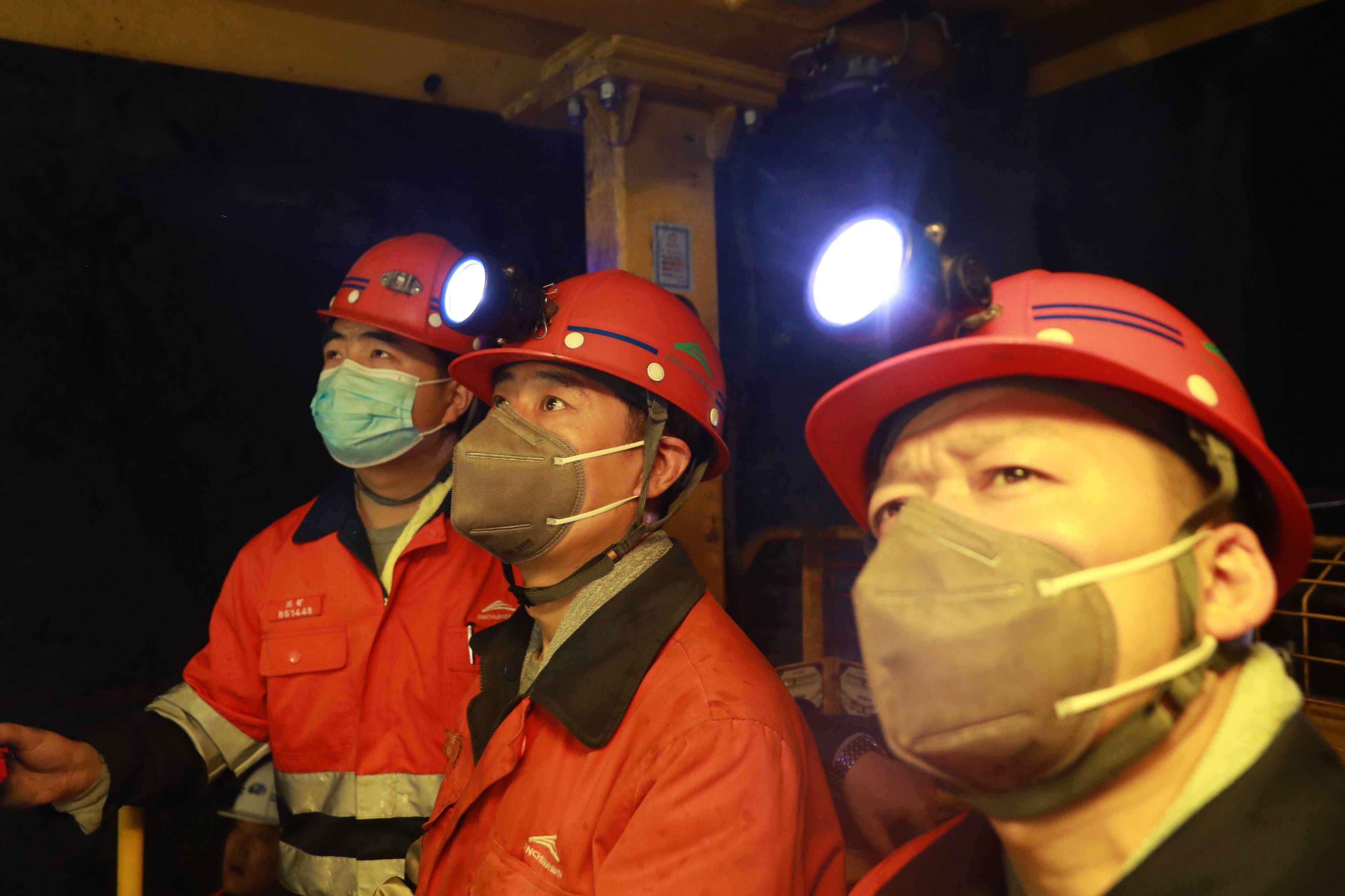 Miners work underground at the third mining zone of the Jinchuan Group in Jinchang, northwest China