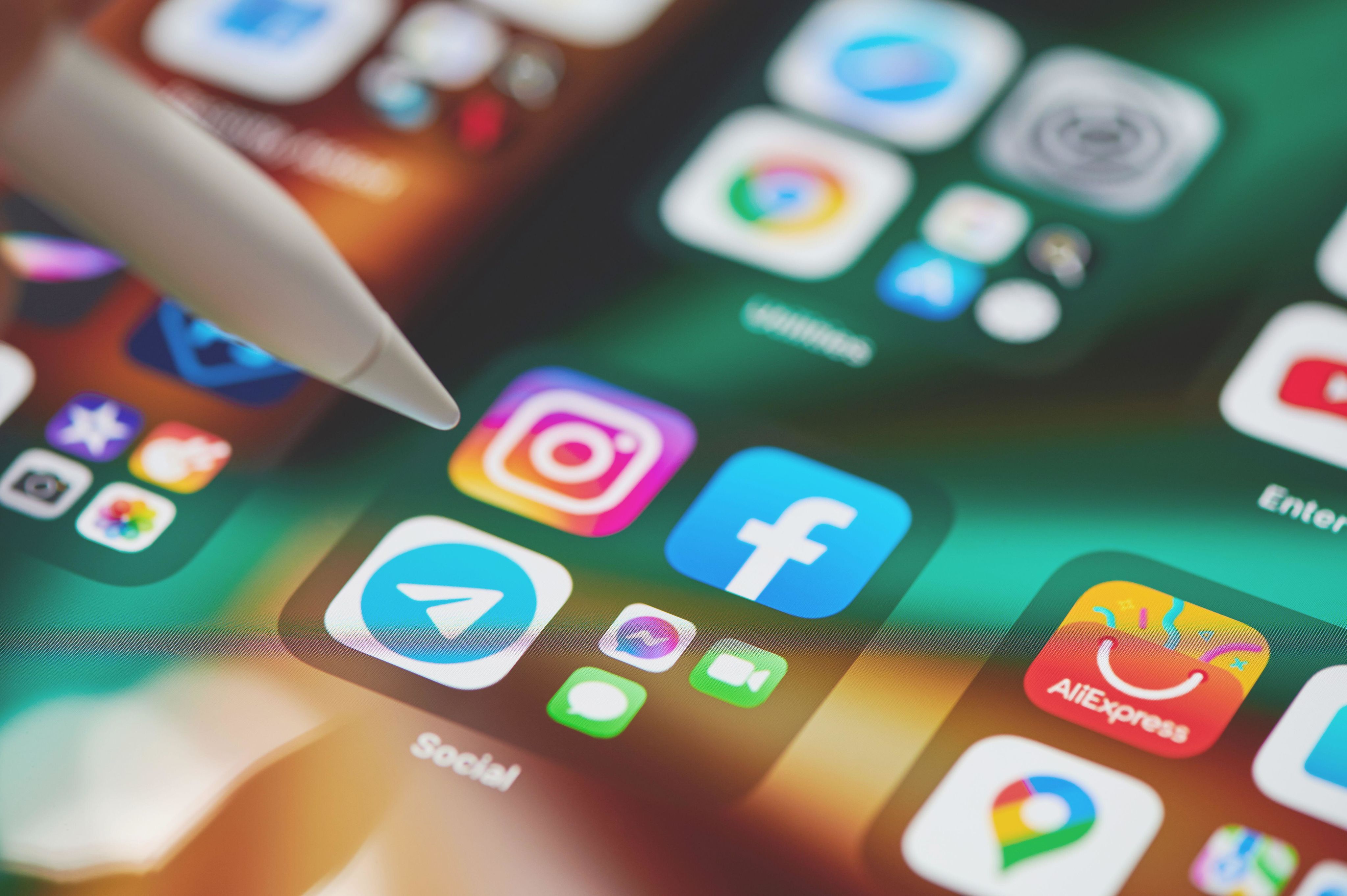 Close up of social media apps on a tablet screen