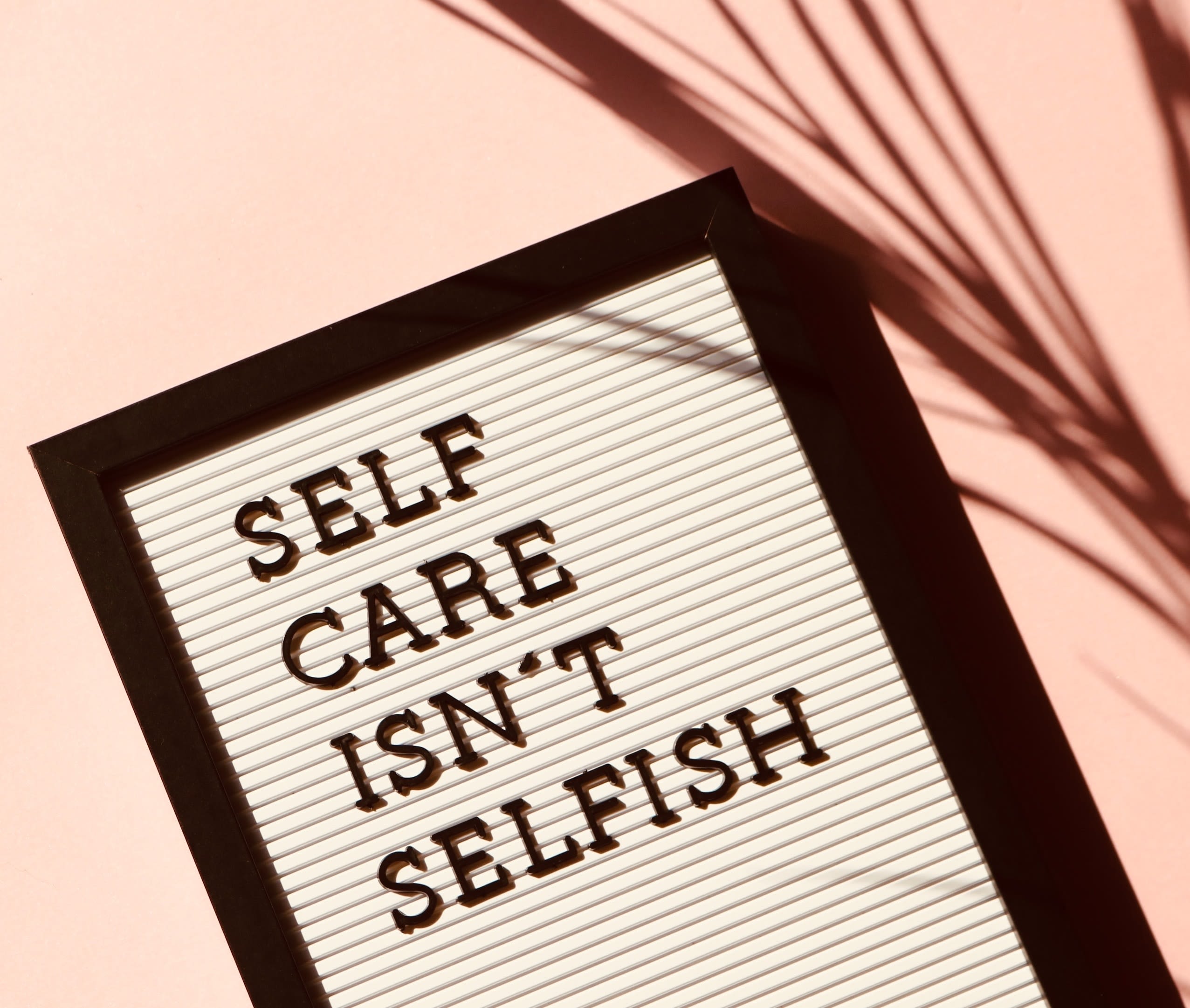 Sign that says "Self Care Isn't Selfish"