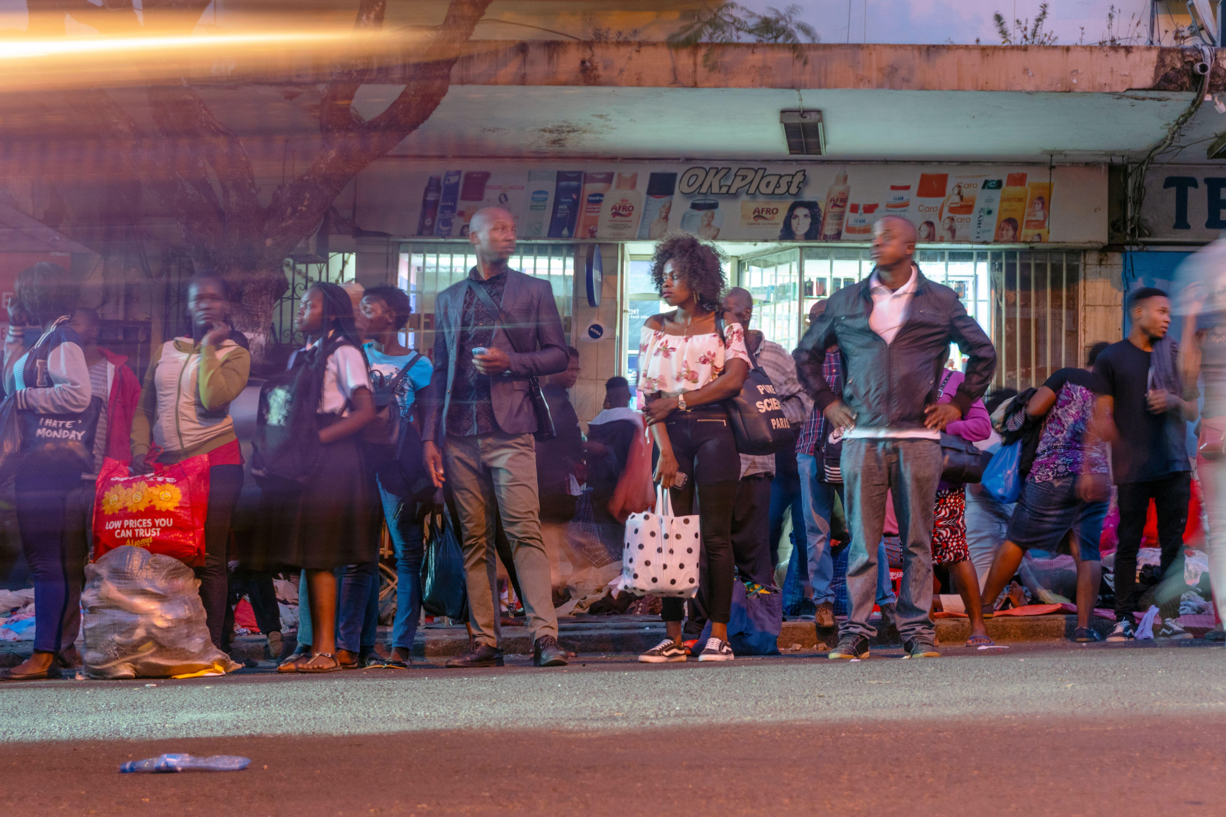 People waiting for a bus in Maputo, Mozambique.