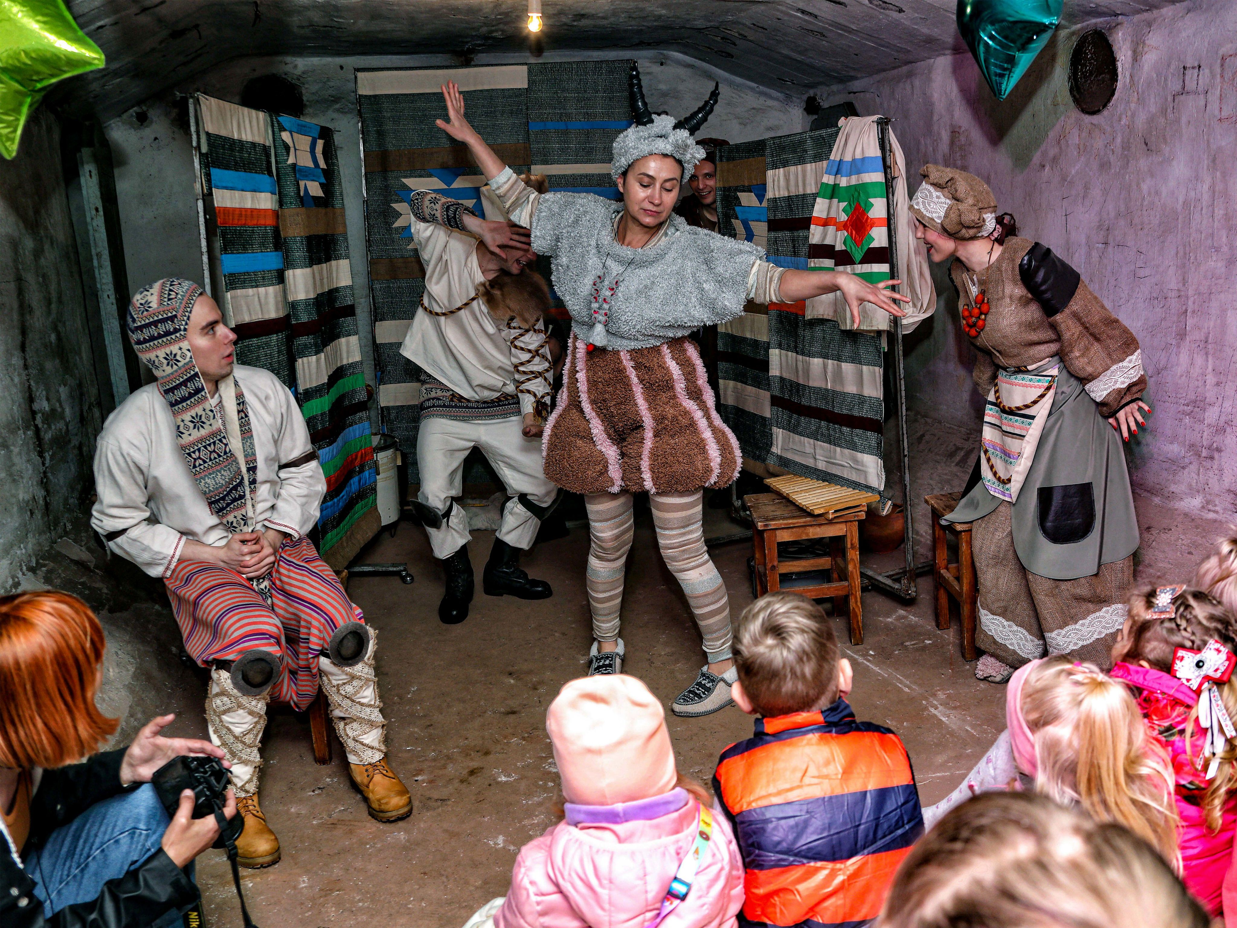 Ukrainian actors perform for children in a bomb shelter